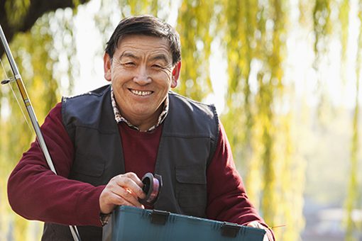 Senior portrait with fishing tackle box Adventurous Travel