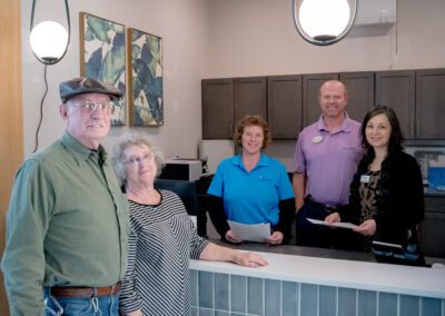 The team of Prime Carolina Coast stands ready to help a pair of older adults.