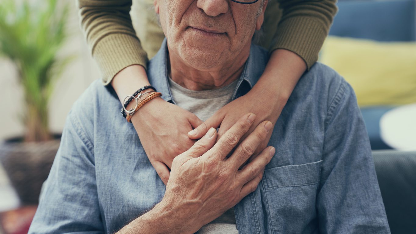 Photo on someone comforting a man