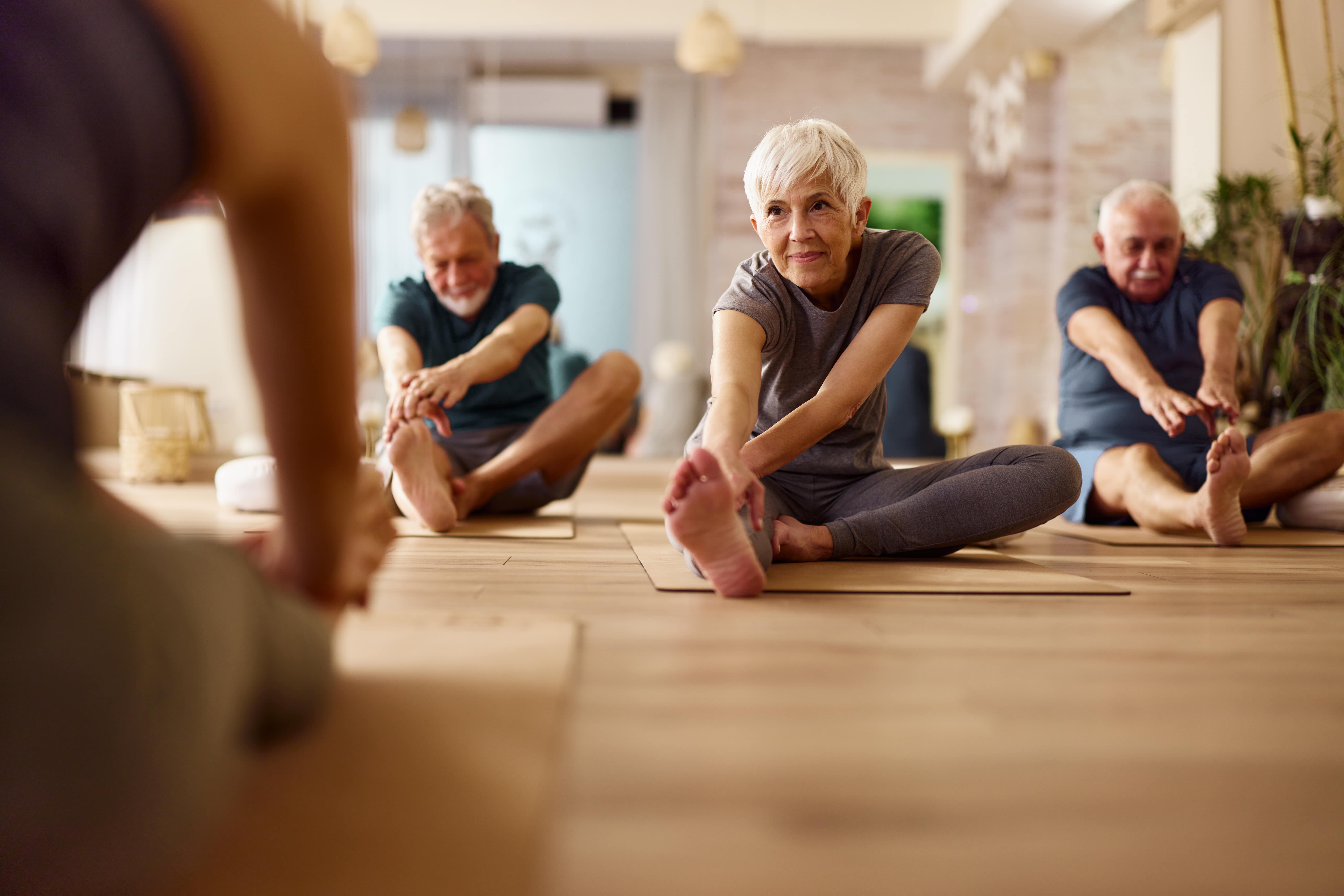 iStock-2149222806-min Seniors doing yoga