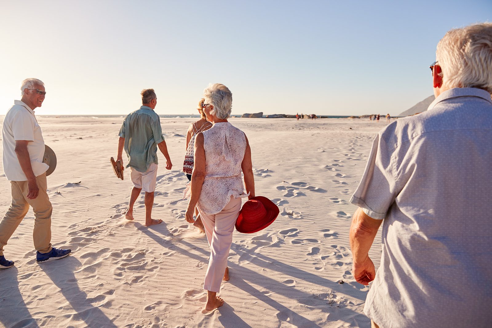 Senior living by the beach Seniors enjoying the beach together